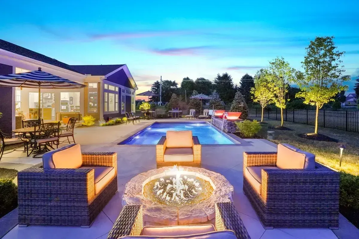 Travertine deck in French pattern around a remodeled pool on a Forsyth County lot in Cumming, GA