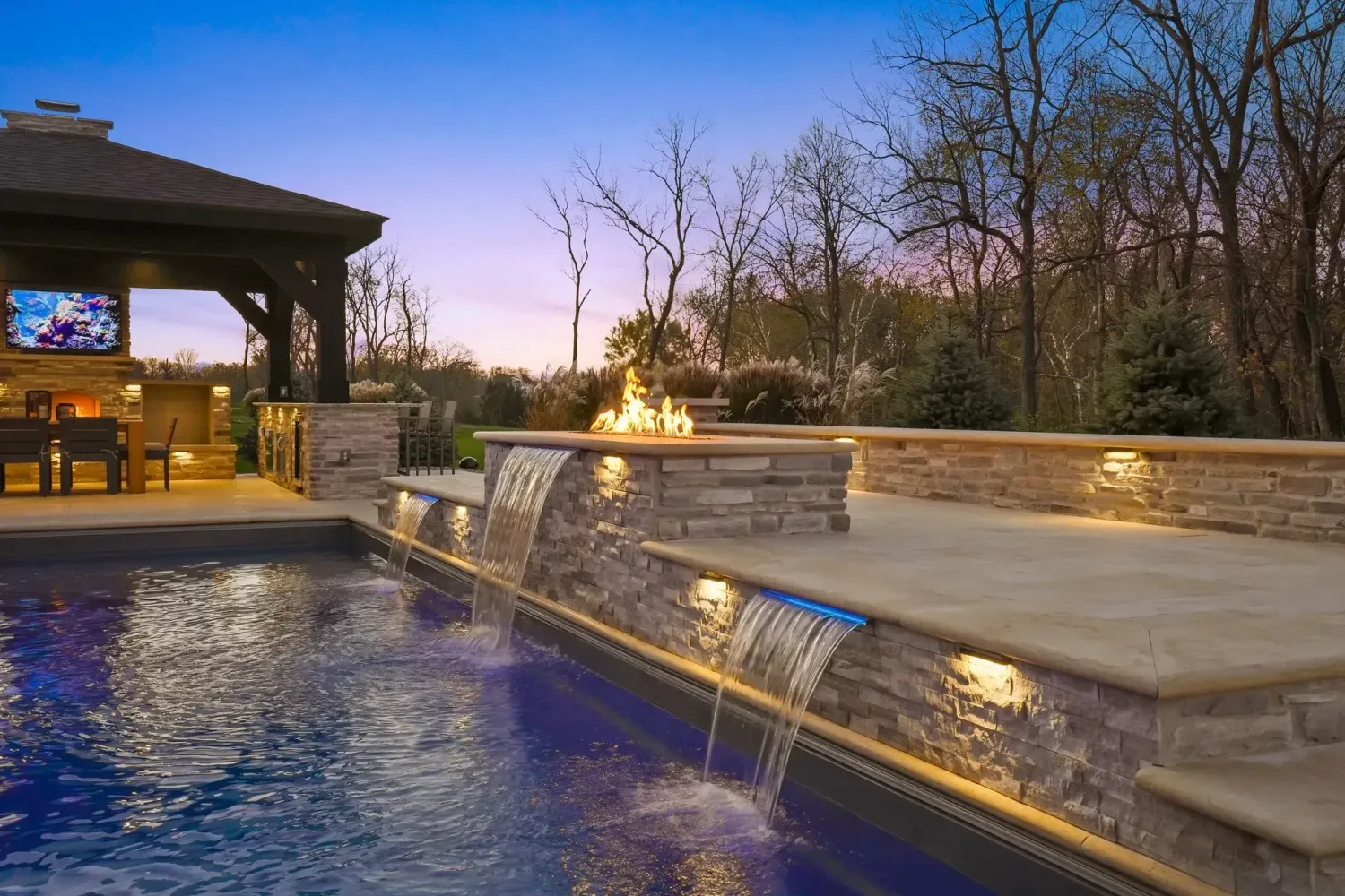 Finished custom pool with water feature and coping in a Dacula, GA backyard on contract-signing day planning