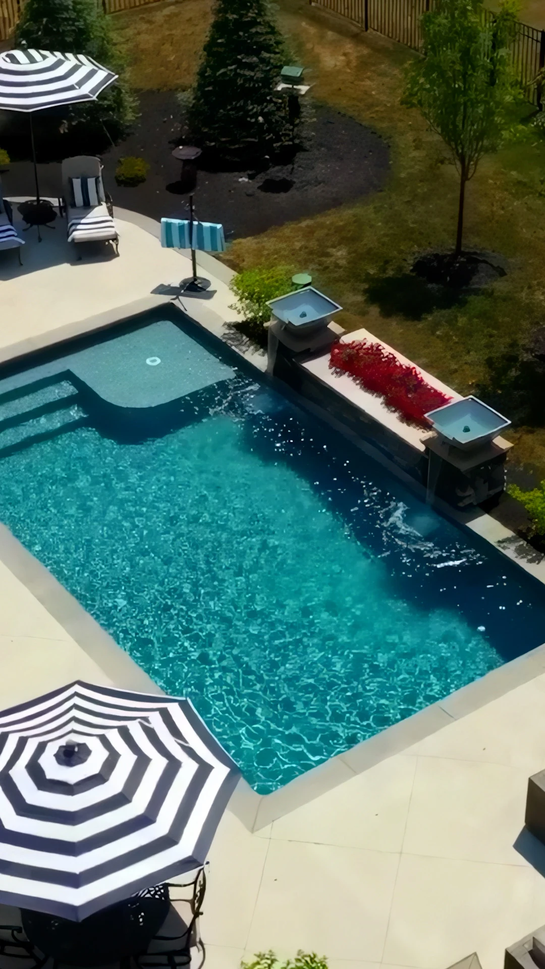 Custom gunite pool with stone deck and drop-face coping overlooking a wooded Dawsonville, Georgia backyard