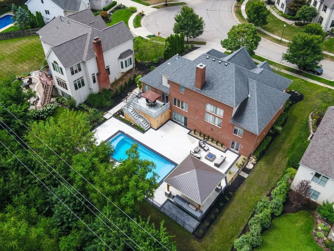 Converting a Milton Family Pool to an Entertainment Pool — Spa, Bar Shelf and Outdoor Kitchen on a Crooked Creek Estate