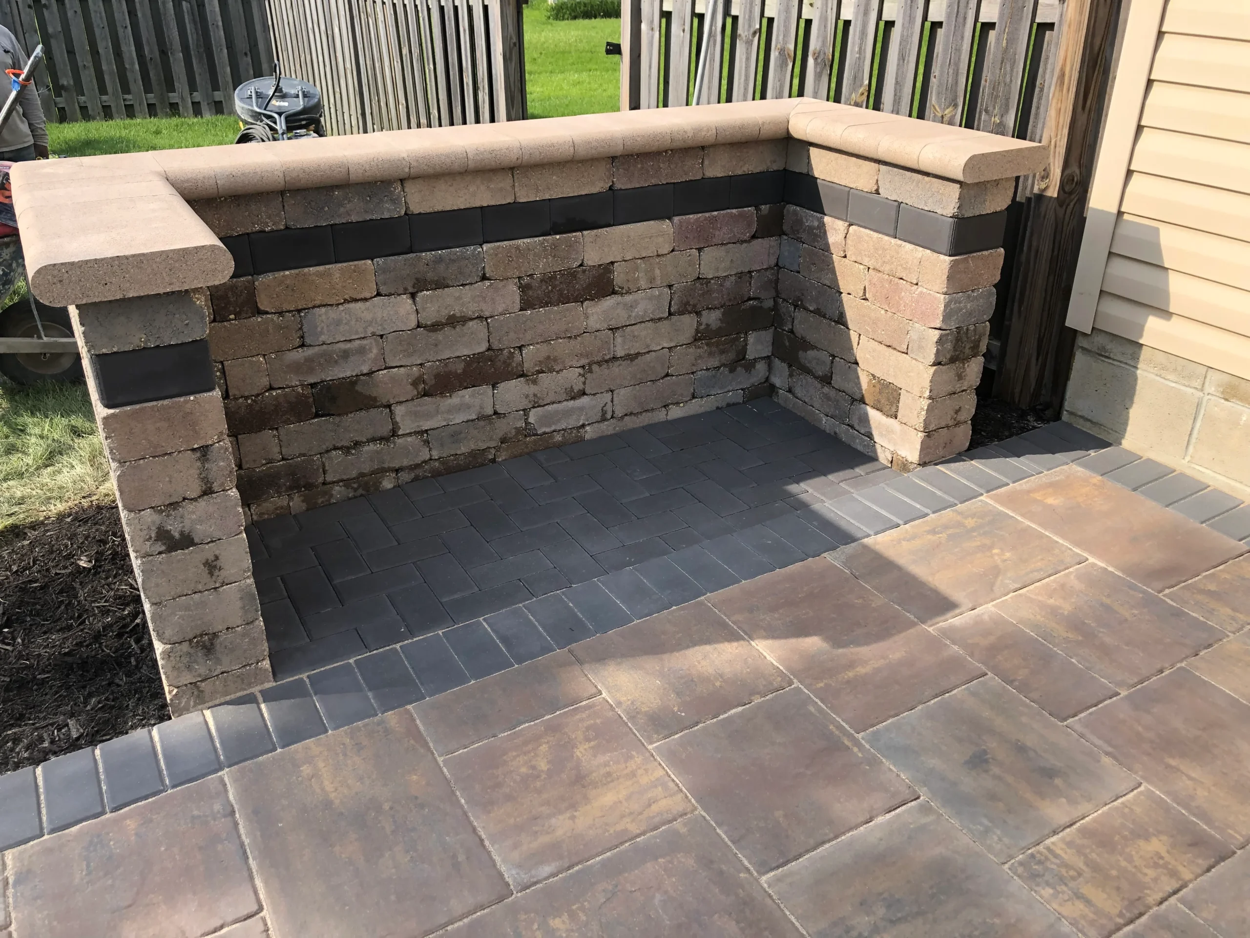 Finished hardscape patio and pool deck in Clarkston GA showing properly integrated stone, drainage, and grading
