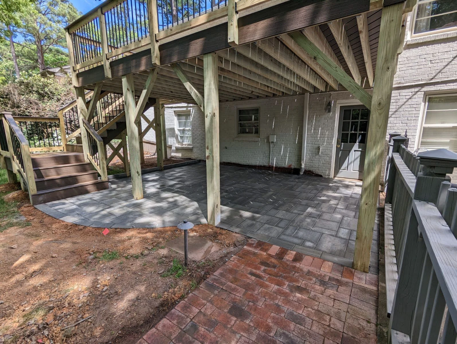 Close view of segmental retaining wall cap and drainage detail at a Forsyth County GA residence