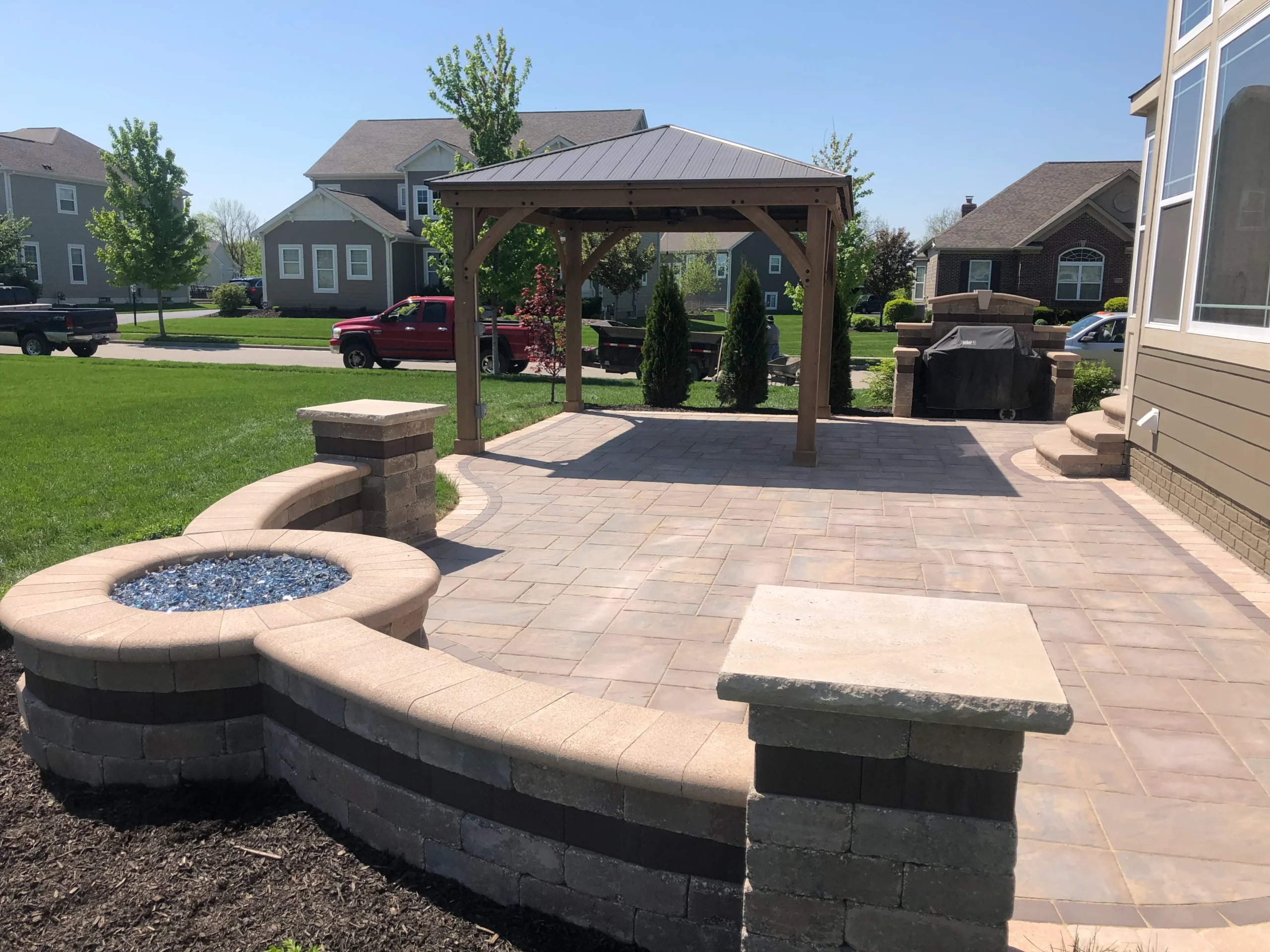 Completed curved hardscape with retaining walls and patio on Milton rolling estate