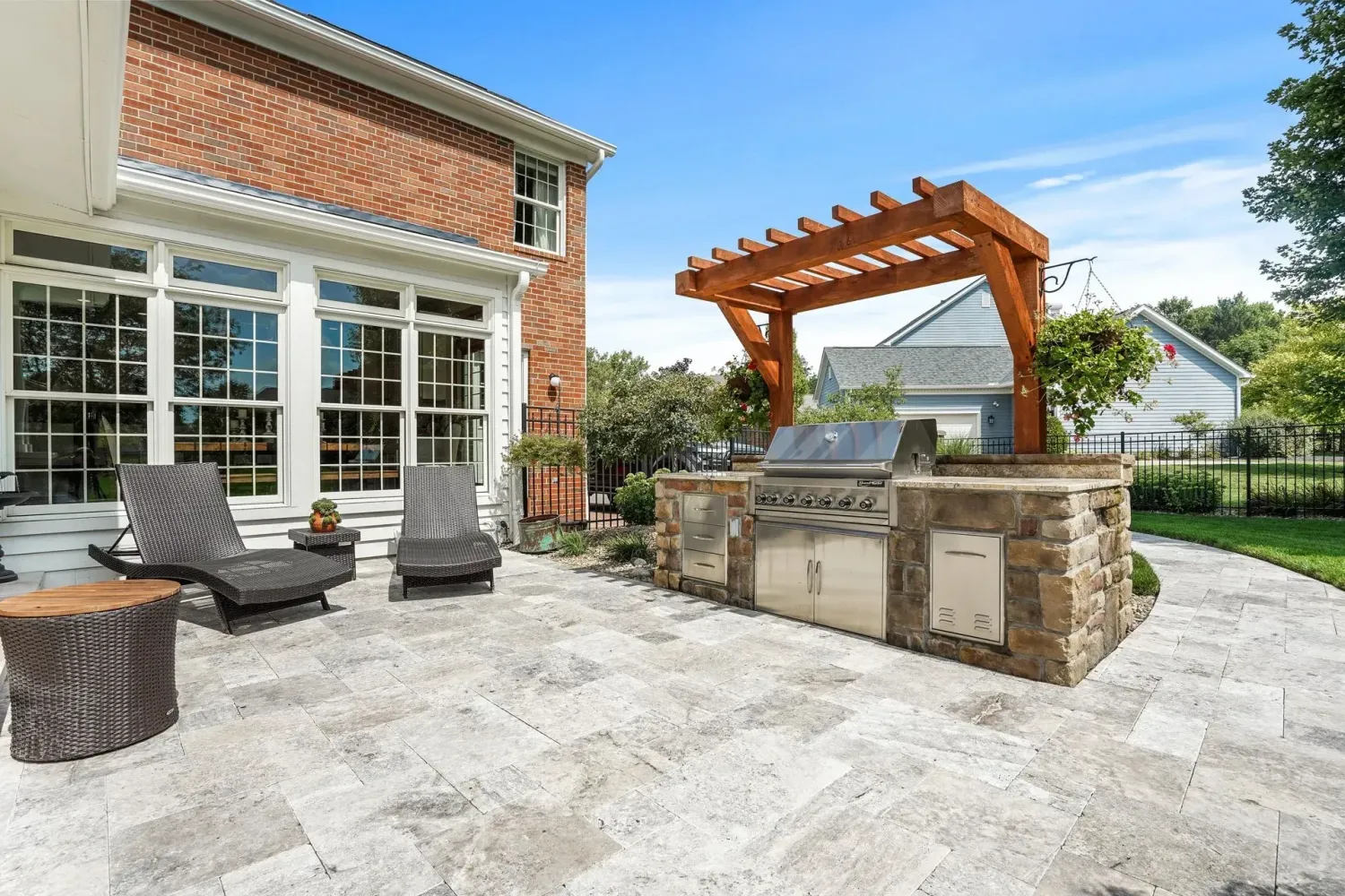 Premium U-shape outdoor kitchen with Kamado Joe, built-in grill, griddle and refrigerator drawers under louvered cedar pavilion in Suwanee, GA
