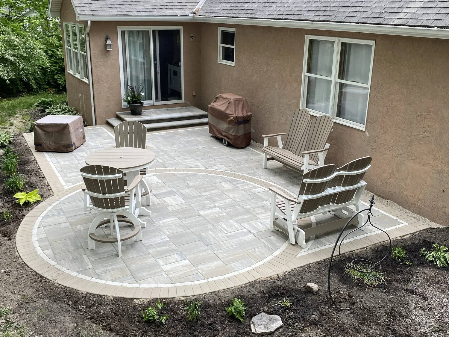 Paver patio with soldier course meeting mature landscape bed and tree canopy edge in Marietta, GA