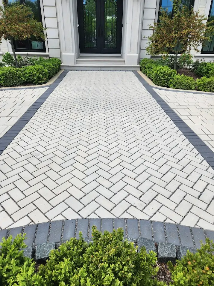 Light porcelain paver pool deck in Clarkston GA with structured surface and clean joint lines for high SRI and slip resistance