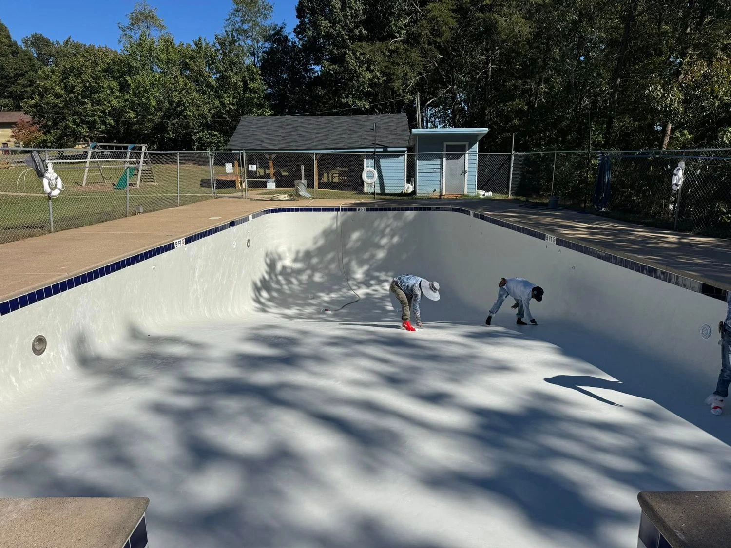 Primetime Pools technicians finishing equipment pad work on a Suwanee GA pool job