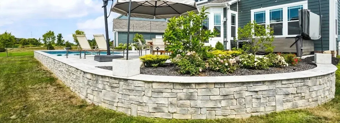 Natural Stone vs Segmental Block Retaining Walls in Alpharetta HOA Subdivisions