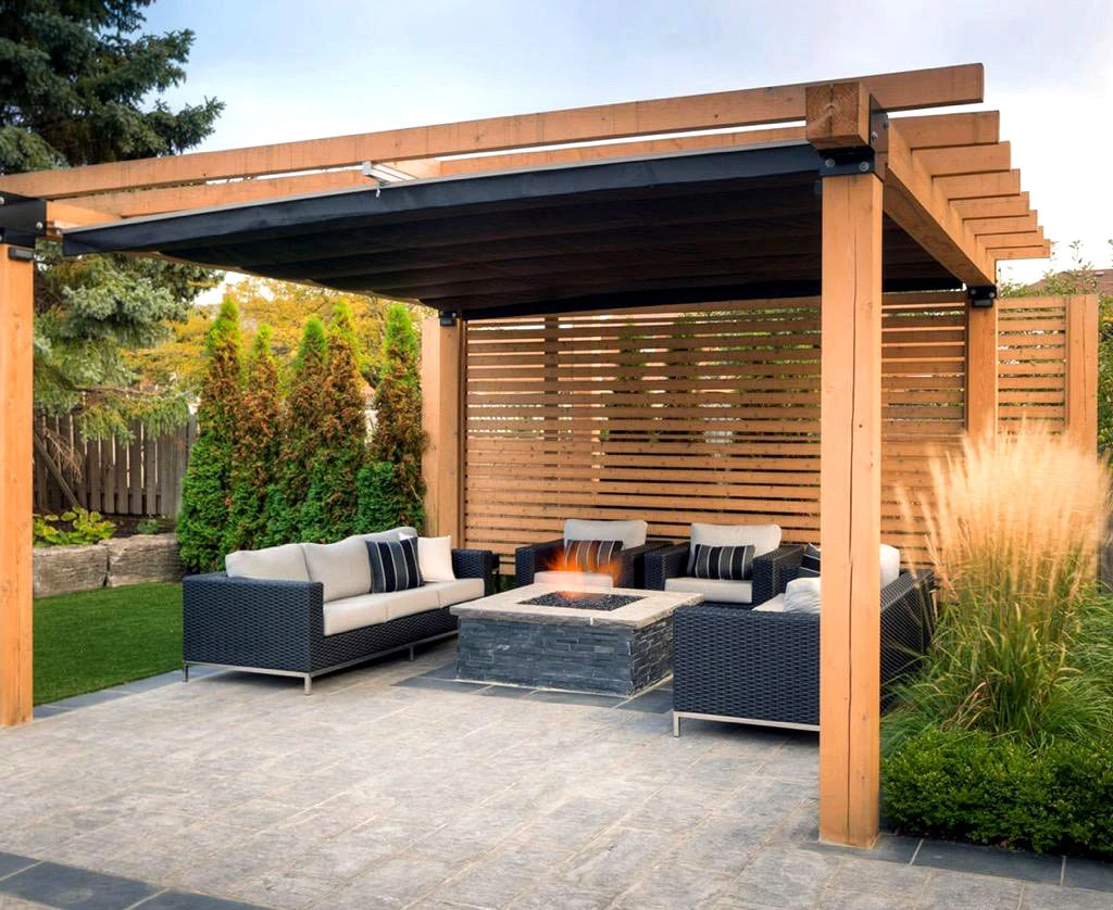 Outdoor fireplace and seating zone integrated with pool deck materials in Alpharetta, GA