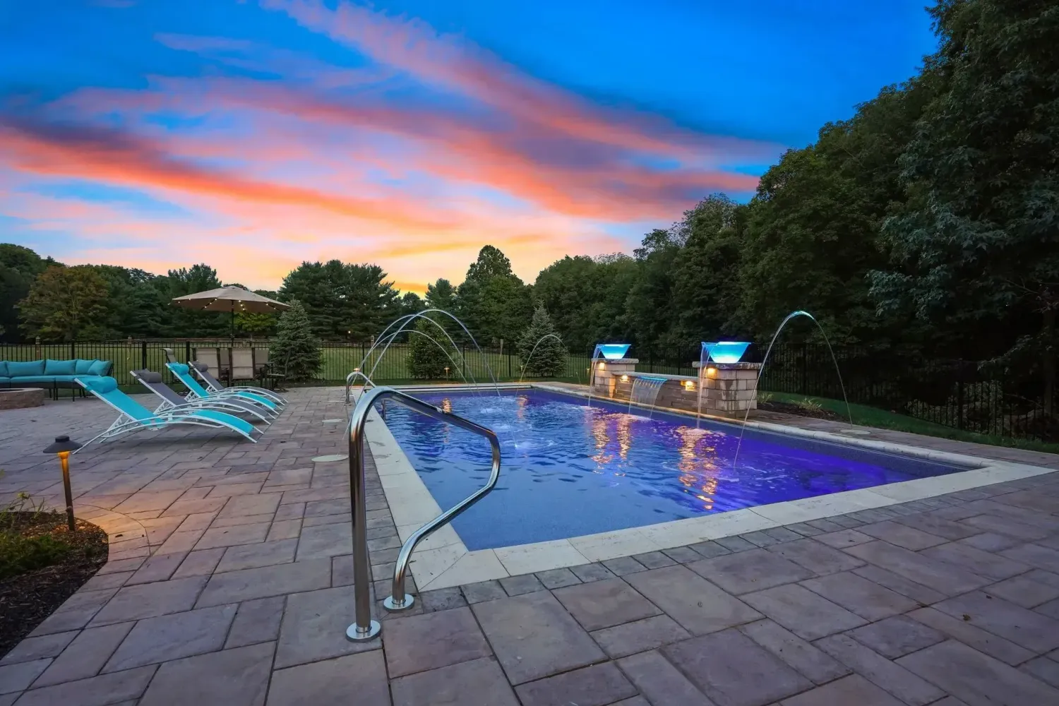 Travertine pool deck in French pattern on Alpharetta, GA backyard showing natural stone texture and color variation