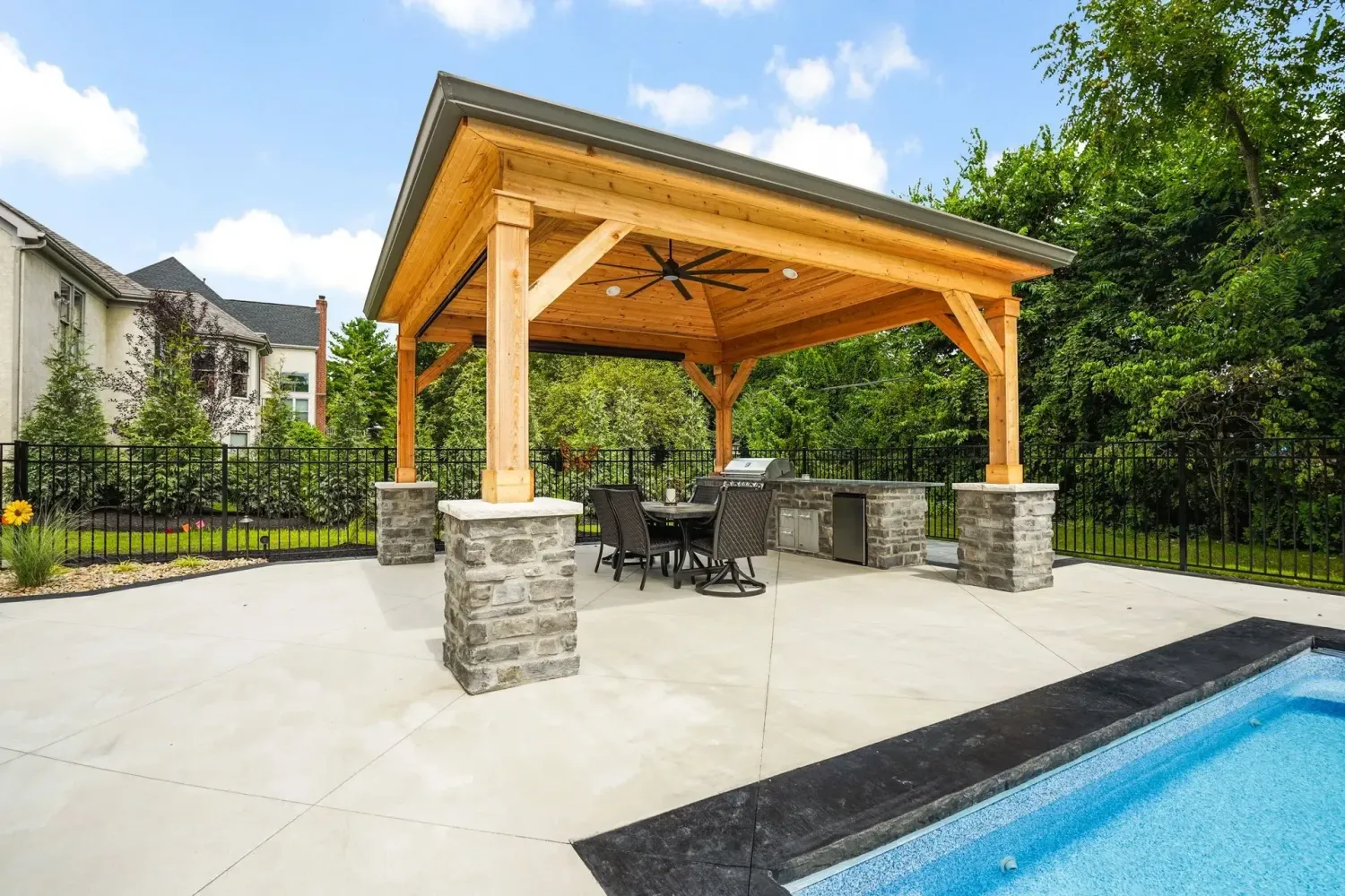 Travertine pool coping with bullnose profile installed over modern rectangular pool in Clarkston GA backyard