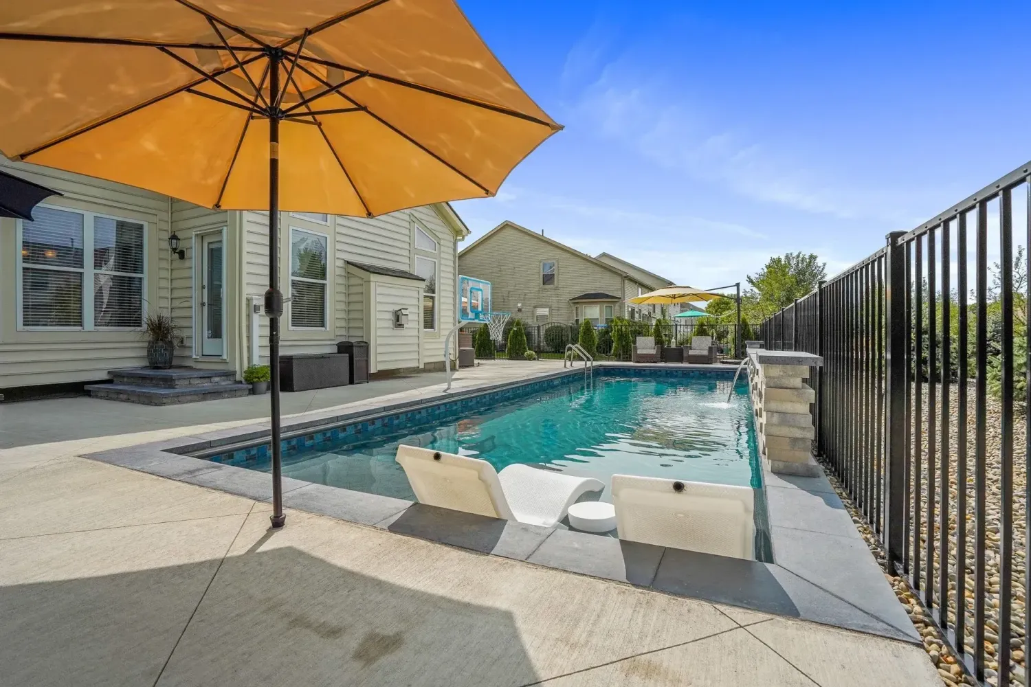 Cumming pool deck with tanning ledge and in-pool loungers, broom-finish surround, Cumming GA